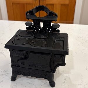 Cast Iron Mini kitchen with supplies. Mini bowls, grater, spoon and more.